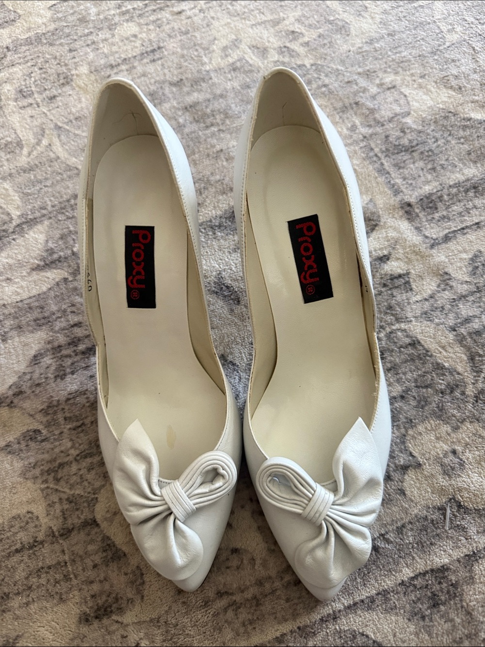 Proxy White Pointed-Toe Pumps with Bow Accent